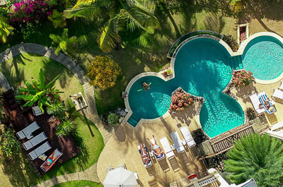 Aerial view of the pool, deck and gardens
